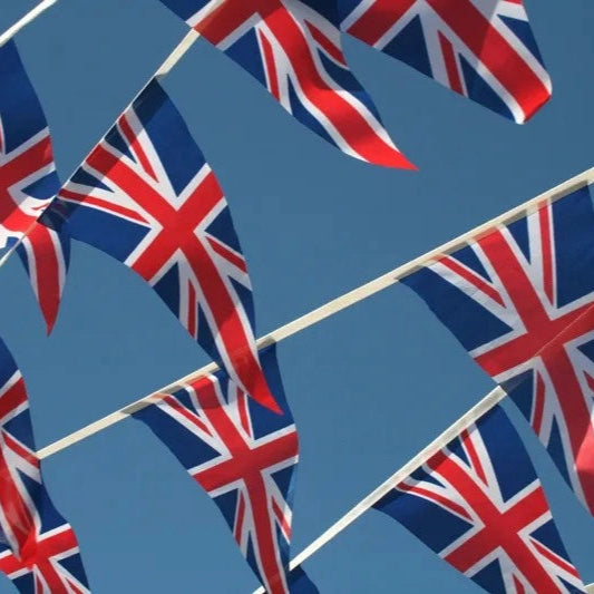 A close-up of triangular bunting flags with a Union Jack design, indicating the product is for decoration purposes and commonly used in the UK for events or displays.
