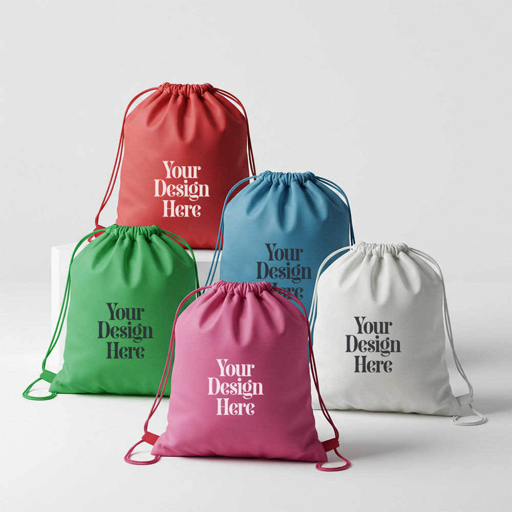 Five drawstring bags in red, green, blue, pink, and white with 'Your Design Here' text on a light gray background.