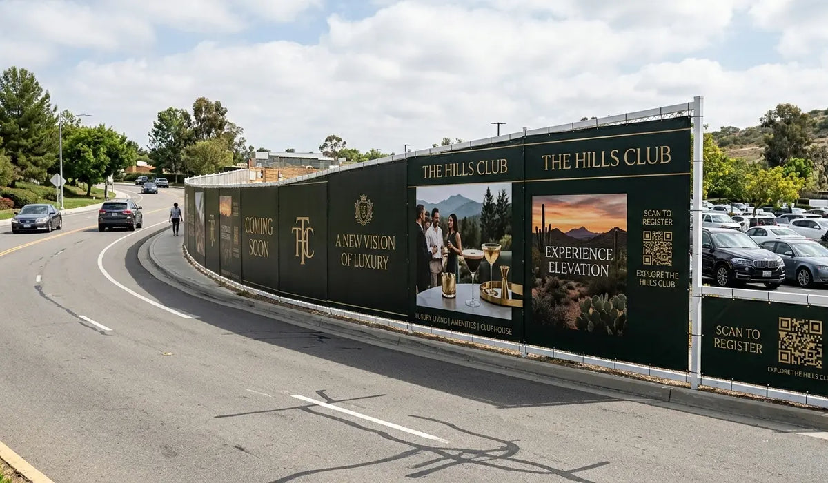 Large outdoor advertisement for 'The Hills Club' on a fence along a road.