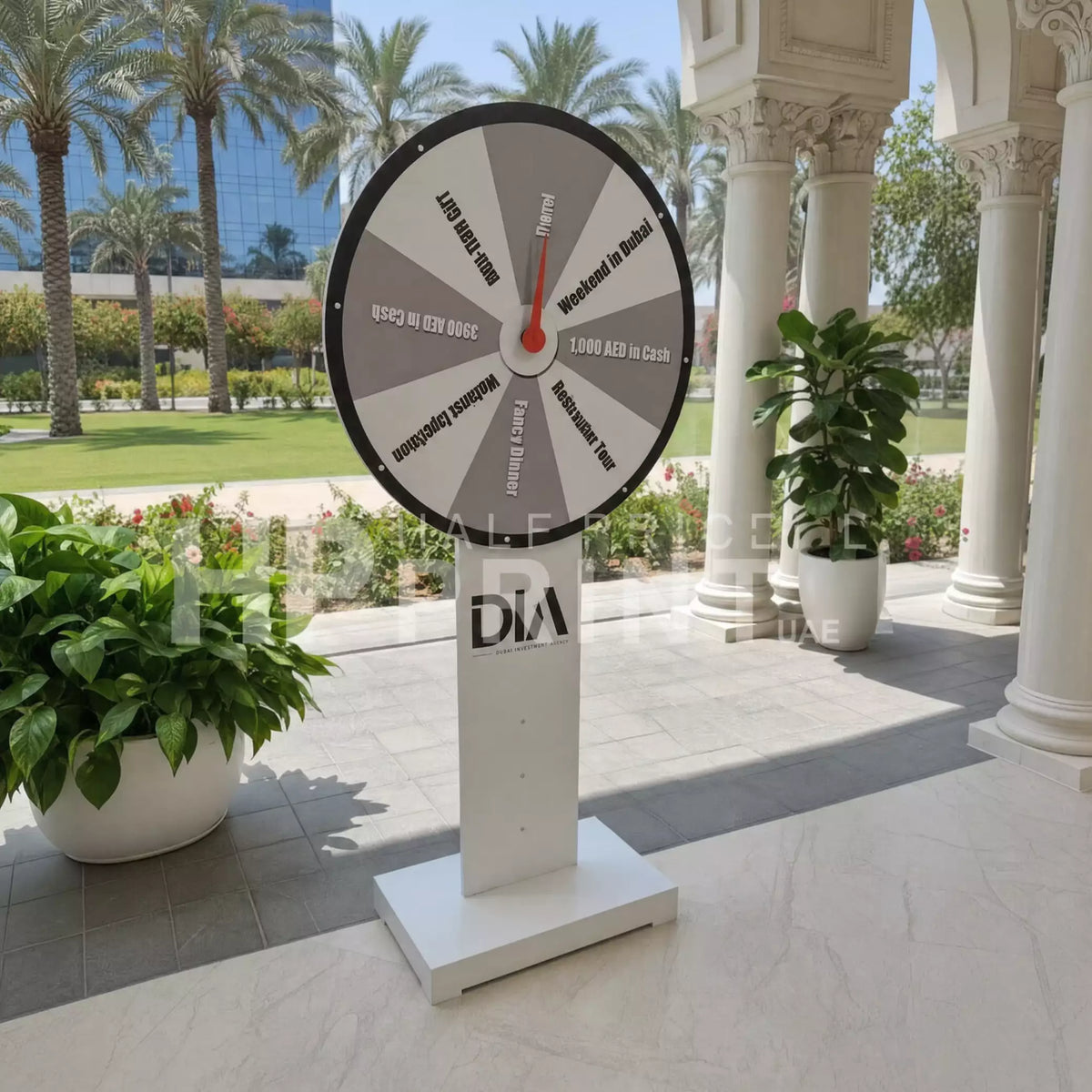 Spin wheel of fortune on a stand with 'DIA' branding in an outdoor setting.
