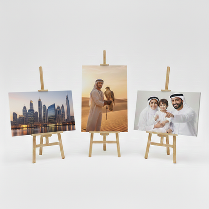 Three photo canvas prints on easels with different subjects displayed on a white background