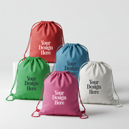 Five drawstring bags in red, green, blue, pink, and white with 'Your Design Here' text on a light gray background.