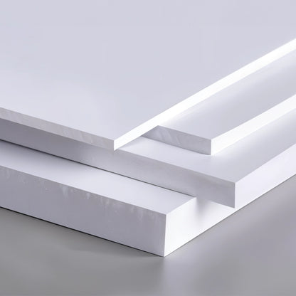 Stack of white foam boards with a glossy finish, displaying the edges and surfaces.