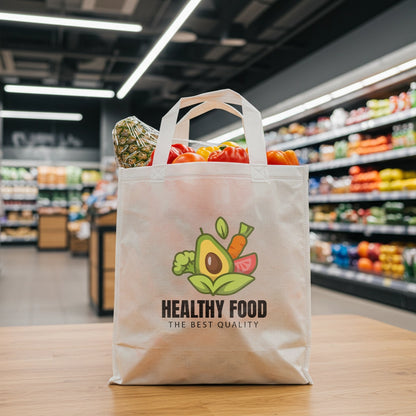 White reusable shopping bag with 'Healthy Food' logo filled with groceries in a supermarket.