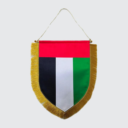 A custom pennant flag with a geometric design featuring red, white, blue, and green colors, with a gold tassel at the bottom.