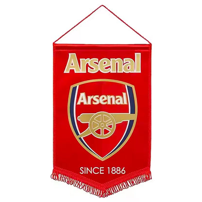 Red Arsenal FC pennant flag featuring the club crest with cannon emblem and ‘Since 1886’ text, finished with a hanging cord and tasselled bottom edge.