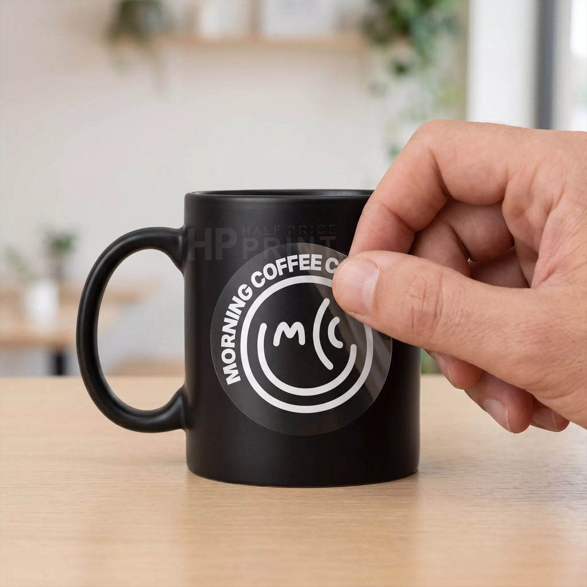 black mug with white inked sticker
