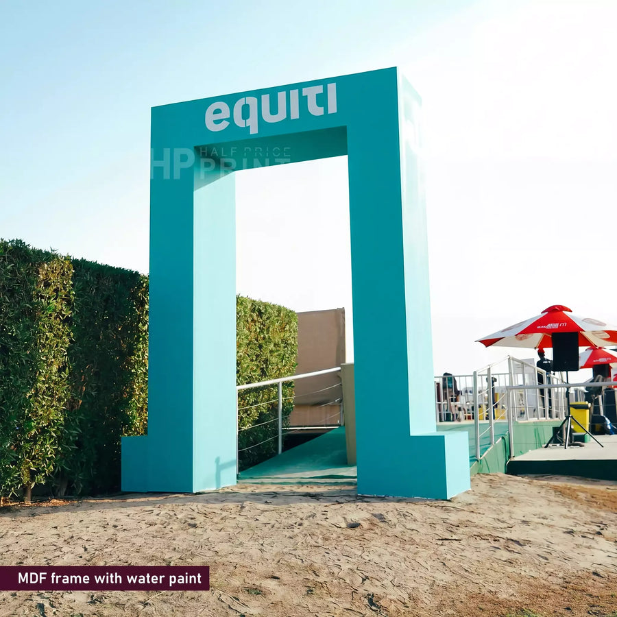 Teal archway with 'equiti' branding in an outdoor setting