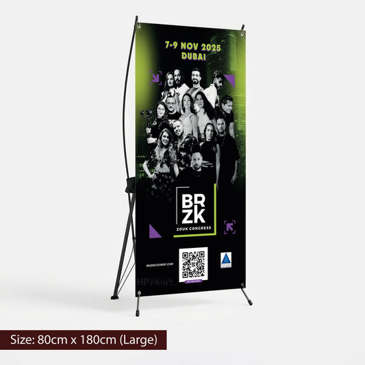 X banner for an event featuring a group of people, with branding and QR code on a stand.
